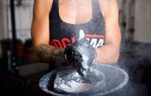 rocktape-talons-crossfit-hand-gloves-black-with-red-accents-crossfit-athlete-demonstrating-chalk-application-by-rocktape