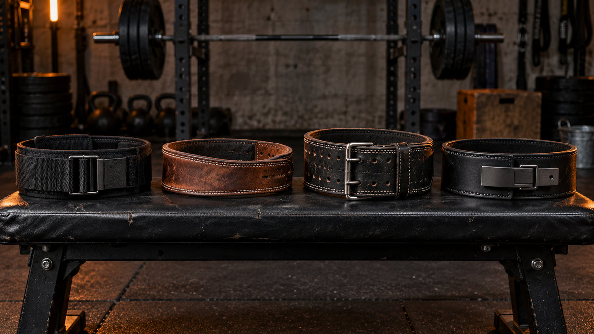 Four weightlifting belt styles compared in a dark functional garage gym