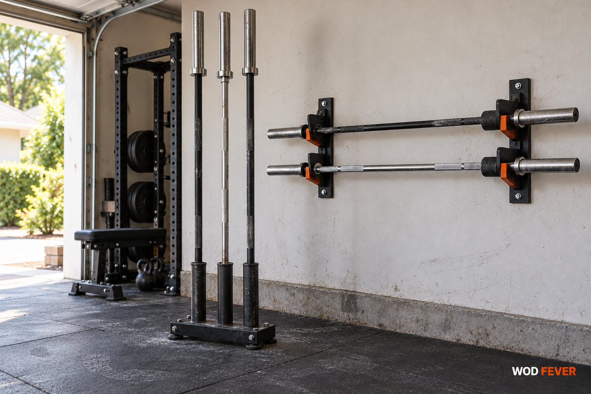 Vertical floor barbell holder beside a wall-mounted horizontal barbell rack in a garage gym