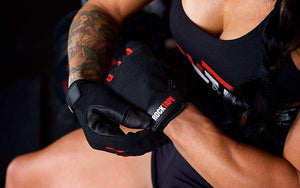 rocktape-talons-crossfit-hand-gloves-black-with-red-accents-crossfit-athlete-demonstrating-strap-adjustment-by-rocktape